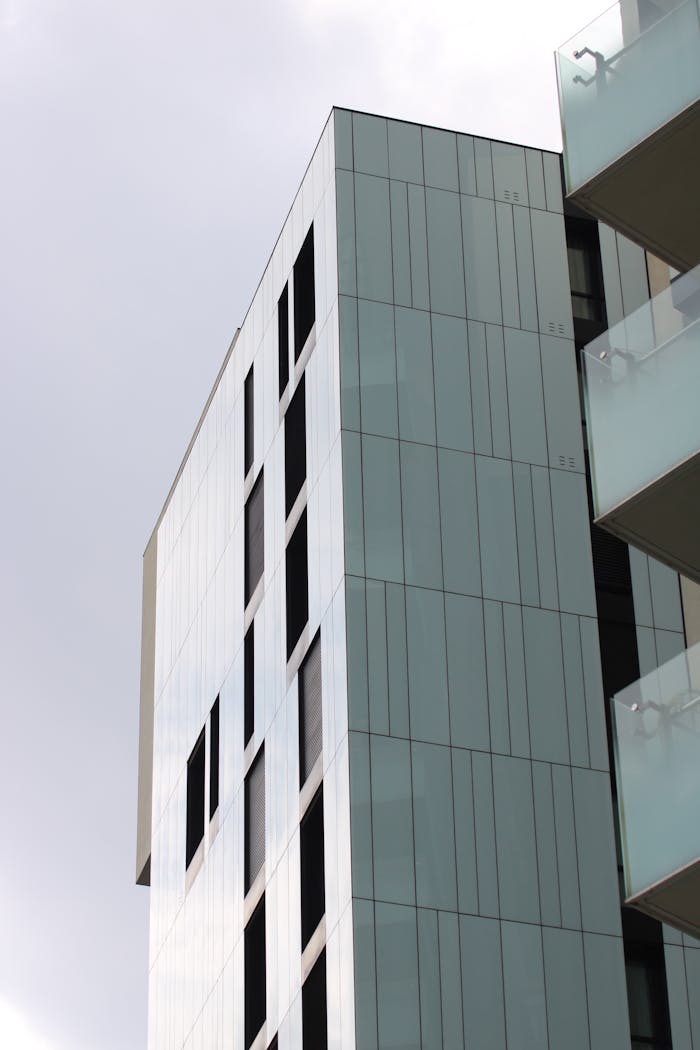 Sleek modern skyscraper with glass facade in Milan's Porta Garibaldi, Italy.