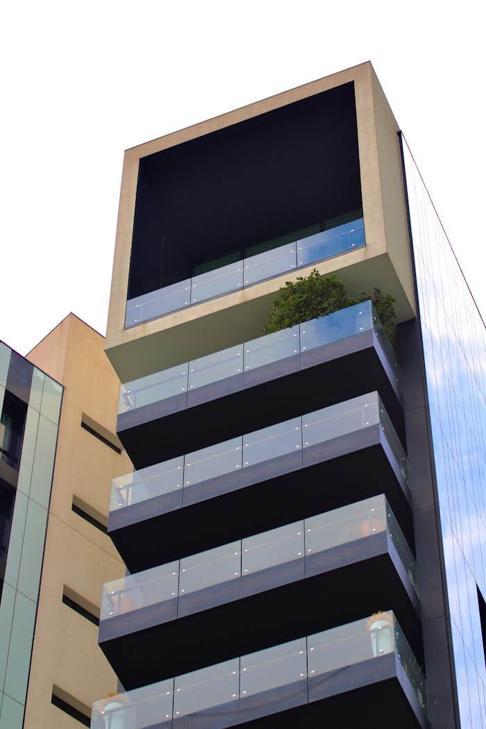 Contemporary skyscraper with glass balconies in Milan's Porta Garibaldi district.